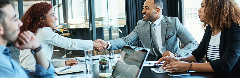 Business owners discussing a business budget. 