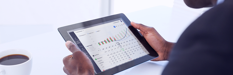 Business owner using financial tools to optimise their cash flow management. 