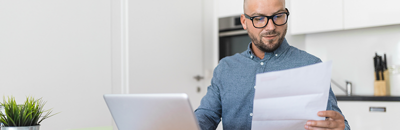 Business owner compares current banking features with digital banking features. 