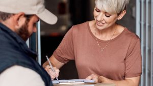 a business owner signing a trade credit agreement.